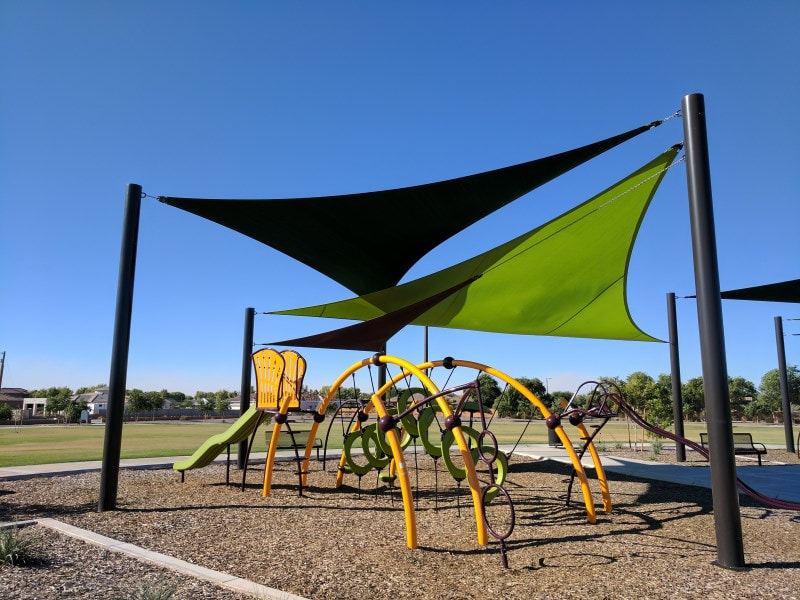 Commercial shade sail structure over an outdoor seating area