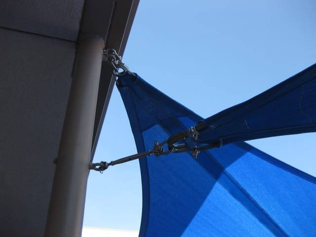 Real shade sail corner hardware and fabric tension detail